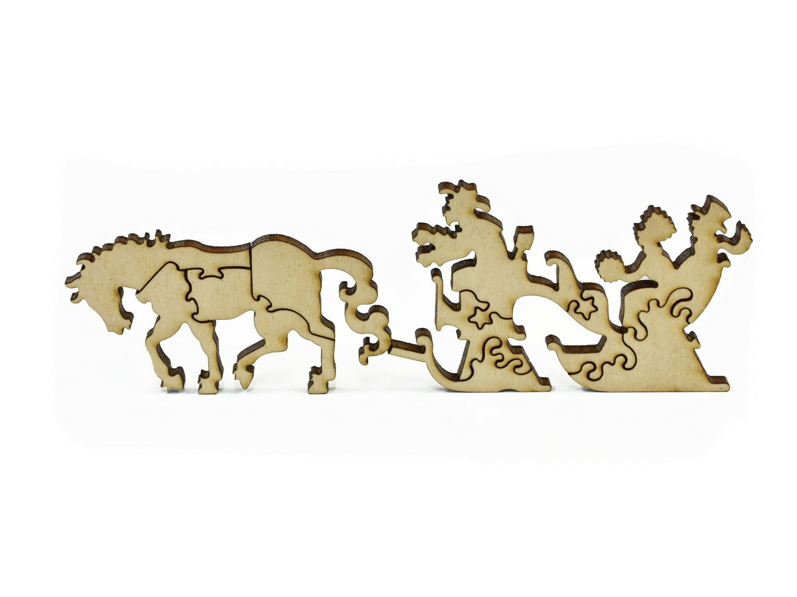 A closeup of pieces in the shape of a horse pulling a sleigh.