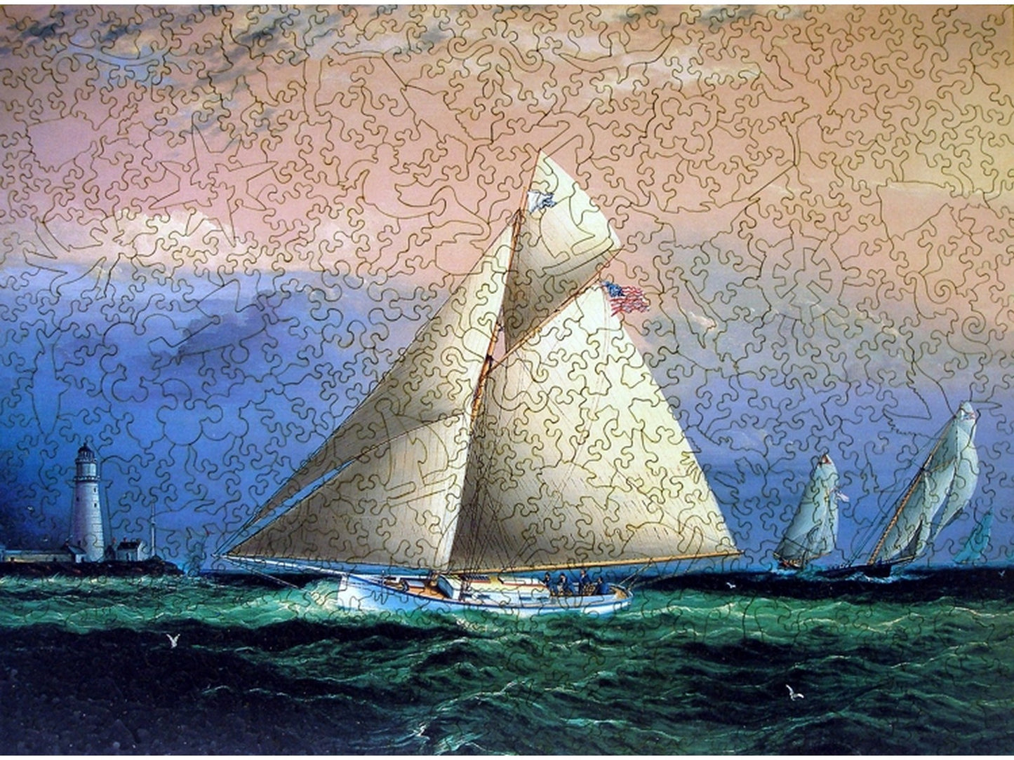The front of the puzzle, Yacht Race Off Boston Light, which shows a sailboat going past a lighthouse.